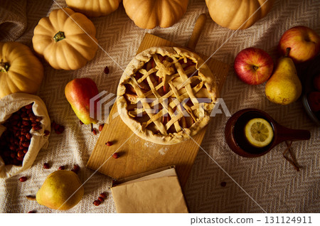 Autumn Thanksgiving Table Scene With Lattice Pie, Pumpkins, Apples, Pears, And Cozy Home Feel Autumn Thanksgiving Table Scene With Lattice Pie, Pumpkins, Apples, Pears, And Cozy Home Feel 131124911