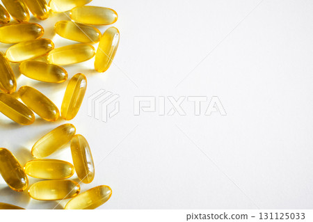 Omega-3 fish oil capsules on white background with healthy supplement concept 131125033