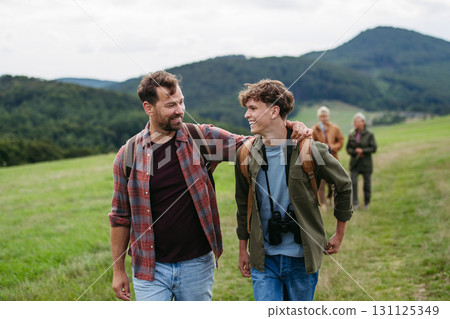 Father spending weekend with son on hike in nature. 131125349