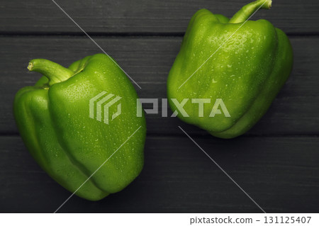 Macro Photo food vegetable green bell peppers on black background. 131125407