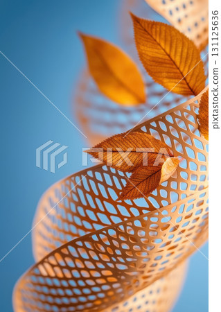 Abstract glowing leaves intertwined with spiral mesh, creating rhythmic pattern against blue background, evoking sense of nature elegance 131125636
