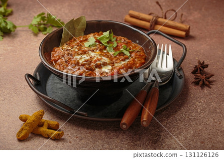 Dal makhani with cream and coriander in bowl is served with spices, traditional dish of India 131126126