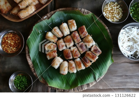 Vietnamese cuisine featuring spring rolls, rice paper wraps, and flavorful side dishes 131126622