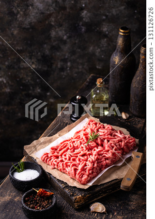Raw minced meat on dark background Raw minced meat on dark background 131126726