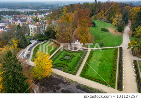 Aerial view of Hluboka Castle in the Czech Republic, highlighting the roof and surrounding area. This stunning landmark is a masterpiece of neo-gothic architecture in South Bohemia 131127257