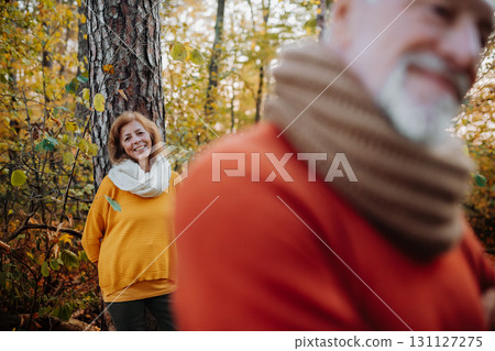 Portrait of senior woman looking at her husband in autumn nature. Portrait of senior woman looking at her husband in autumn nature. 131127275