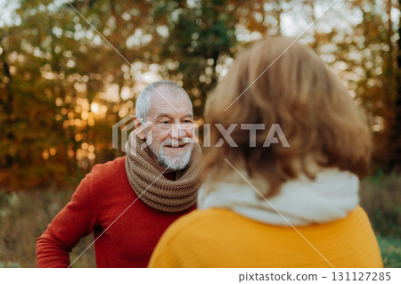 Portrait of senior couple in autumn nature. 131127285