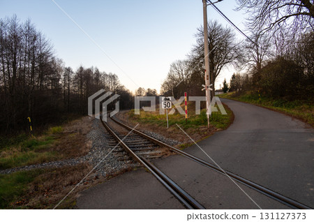 A nostalgic view of the railway tracks, signals, and station in the village of Bila Voda, depicting a small local line on the brink of closure, evoking a sense of history and transition 131127373