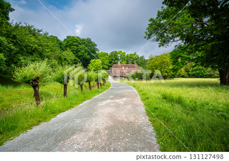 The Old Grandmother's House in Babiccino Valley is a charming historical cottage surrounded by lush greenery, blooming meadows, and the serene Upa River, embodying the essence of Bozena Nemcova's 131127498