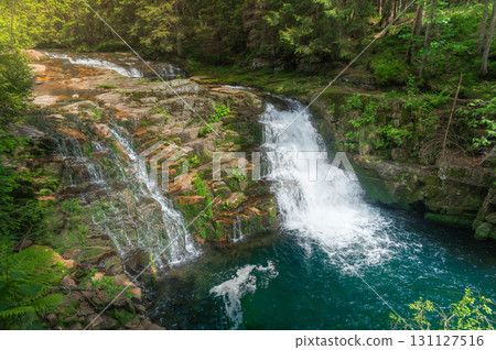 Krkonose mountains - waterfall scenic nature moss green background - white wild water falling from rocks making romantic veils. KRNAP (Krkonossky National Park), Czech Republic Krkonose mountains - waterfall scenic nature moss green background - white wild water falling from rocks making romantic veils. KRNAP (Krkonossky National Park), Czech Republic 131127516