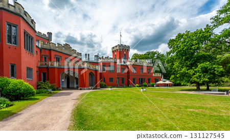 Romantic castle with red facade. Hradek u Nechanic. Czech Republic. Nechanice. Panoramic exterior view. Romantic castle with red facade. Hradek u Nechanic. Czech Republic. Nechanice. Panoramic exterior view. 131127545