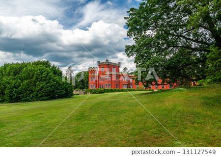 Romantic castle with red facade. Hradek u Nechanic. Czech Republic. Nechanice. Panoramic exterior view. Romantic castle with red facade. Hradek u Nechanic. Czech Republic. Nechanice. Panoramic exterior view. 131127549