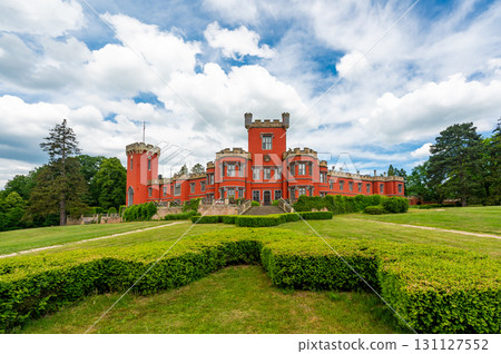 Romantic castle with red facade. Hradek u Nechanic. Czech Republic. Nechanice. Panoramic exterior view. 131127552