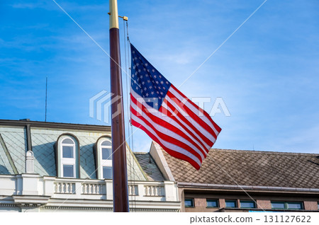 The American flag waves proudly near the U.S. Army memorial in Plzen, Czech Republic. A powerful tribute to the historic alliance and liberation of the city during WWII. The American flag waves proudly near the U.S. Army memorial in Plzen, Czech Republic. A powerful tribute to the historic alliance and liberation of the city during WWII. 131127622