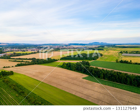 A stunning drone view of Hrusovany u Brna, showcasing the charming town, surrounding vineyards, and a distant, scenic view of the Palava Hills. A stunning drone view of Hrusovany u Brna, showcasing the charming town, surrounding vineyards, and a distant, scenic view of the Palava Hills. 131127649