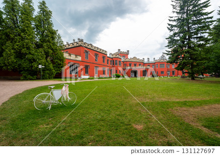 Romantic castle with red facade. Hradek u Nechanic. Czech Republic. Nechanice. Panoramic exterior view. Romantic castle with red facade. Hradek u Nechanic. Czech Republic. Nechanice. Panoramic exterior view. 131127697