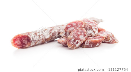 Sliced fuet sausage with mold isolated on white background. Sliced fuet sausage with mold isolated on white background. 131127764