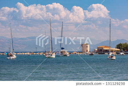 Yachts and windmill in harbor of Corfu Greece on sunny day Yachts and windmill in harbor of Corfu Greece on sunny day 131129230