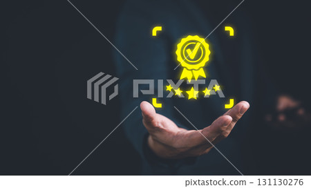 Businessperson holding and showing the best quality assurance with five stars. Quality assurance of business services. Guarantee, warranty, standard, ISO certification and testimonial concept. 131130276