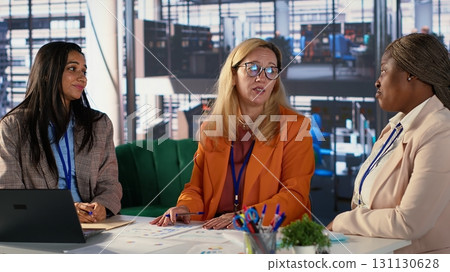 Businesswomen consoling their female boss after hearing bad news, dealing with organizational failure. Group of experts in a problem solving meeting share ideas to repair crisis. Camera A. Businesswomen consoling their female boss after hearing bad news, dealing with organizational failure. Group of experts in a problem solving meeting share ideas to repair crisis. Camera A. 131130628