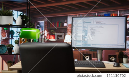 Software development and coding being done on PC, implementing algorithms. Code editor on computer screen in home office used for building applications and optimizing performance 131130702