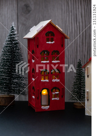 Craft wooden houses with candlelight for conscientious Merry Christmas decor. Sustainable celebration minimal responsible DIY holiday project. Festive modern Craft wooden houses with candlelight for conscientious Merry Christmas decor. Sustainable celebration minimal responsible DIY holiday project. Festive modern 131131924
