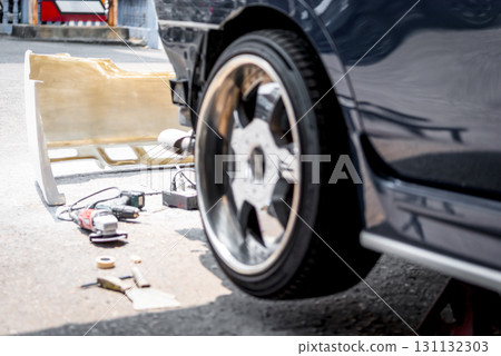 Checking car body work fiber bumper at car garage Checking car body work fiber bumper at car garage 131132303