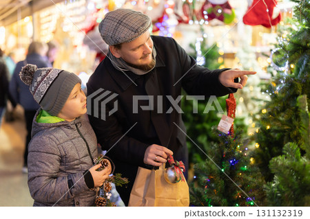 Father and son at the Christmas market 131132319