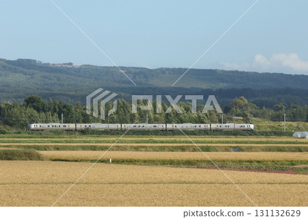 The Kamui express train speeding through the fruitful Sorachi area. Kamui Hakodate Main Line The Kamui express train speeding through the fruitful Sorachi area. Kamui Hakodate Main Line 131132629