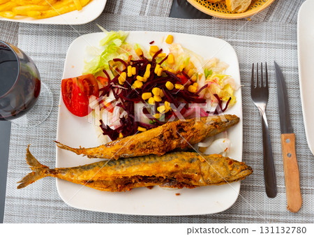Fried mackerel with vegetables and corn grains 131132780