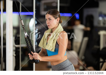 Woman doing arm exercises Woman doing arm exercises 131132844