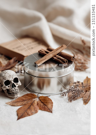 Elegant Halloween Tin Mockup with Autumn Leaves and Miniature Skull 131133481