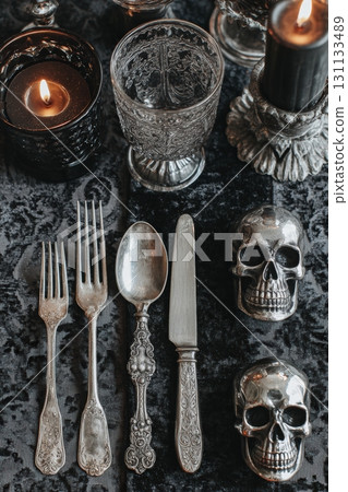 Halloween Dinner Setting with Antique Silverware and Skull Glassware 131133489