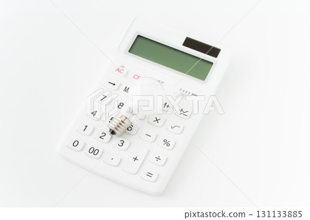 Light bulb and calculator on white background 131133885