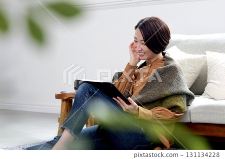 Videophone Woman operating tablet 131134228