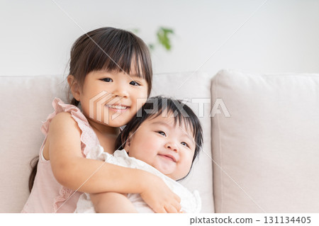 3-year-old girl and baby 131134405