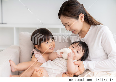 Mom, girl and baby Mom, girl and baby 131134417