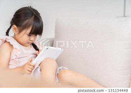 3-year-old girl tablet 131134449