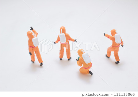 Miniature Orange Astronaut Figures Exploring Space Scene 131135066