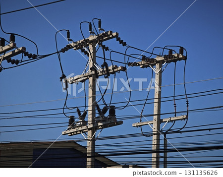 Electrical pole with electrical cables against the sky. Electrical pole with electrical cables against the sky. 131135626