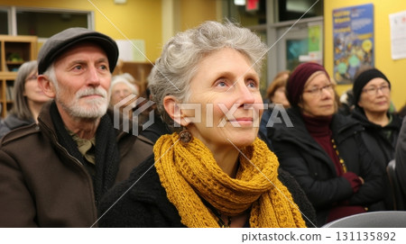 Engaged Audience in Warmly Lit Community Event with Older Adults 131135892