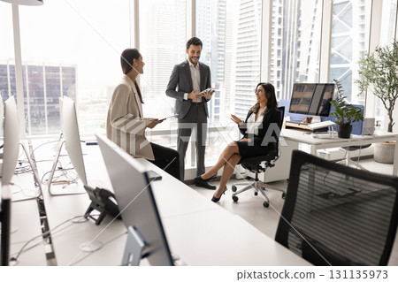Diverse team of positive coworkers planning tasks on meeting Diverse team of positive coworkers planning tasks on meeting 131135973