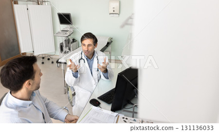 Male doctor discuss treatment plan with patient in examination room Male doctor discuss treatment plan with patient in examination room 131136033