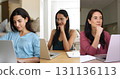 Collage view of three multinational young women using laptops 131136113