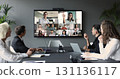 Diverse businesspeople, group of professionals take part in videoconference meeting 131136117