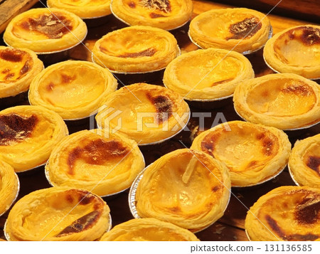 Freshly baked, sweet egg tarts. Freshly baked, sweet egg tarts. 131136585