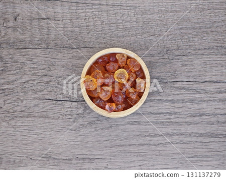 Peach gum in wooden bowl. Peach gum in wooden bowl. 131137279