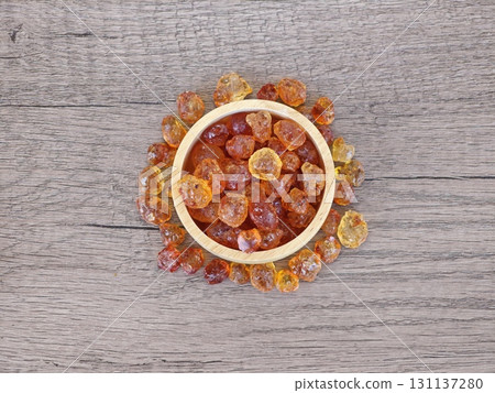 Peach gum in wooden bowl. Peach gum in wooden bowl. 131137280