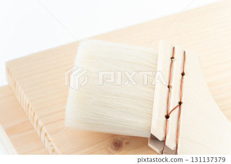 Close-up of a wooden board and brushes Close-up of a wooden board and brushes 131137379