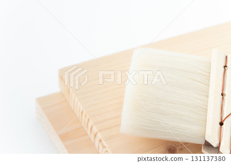 Close-up of a wooden board and brushes 131137380